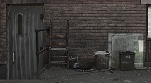 a depressing photo that was taken of garbage piled outside a building in Toronto